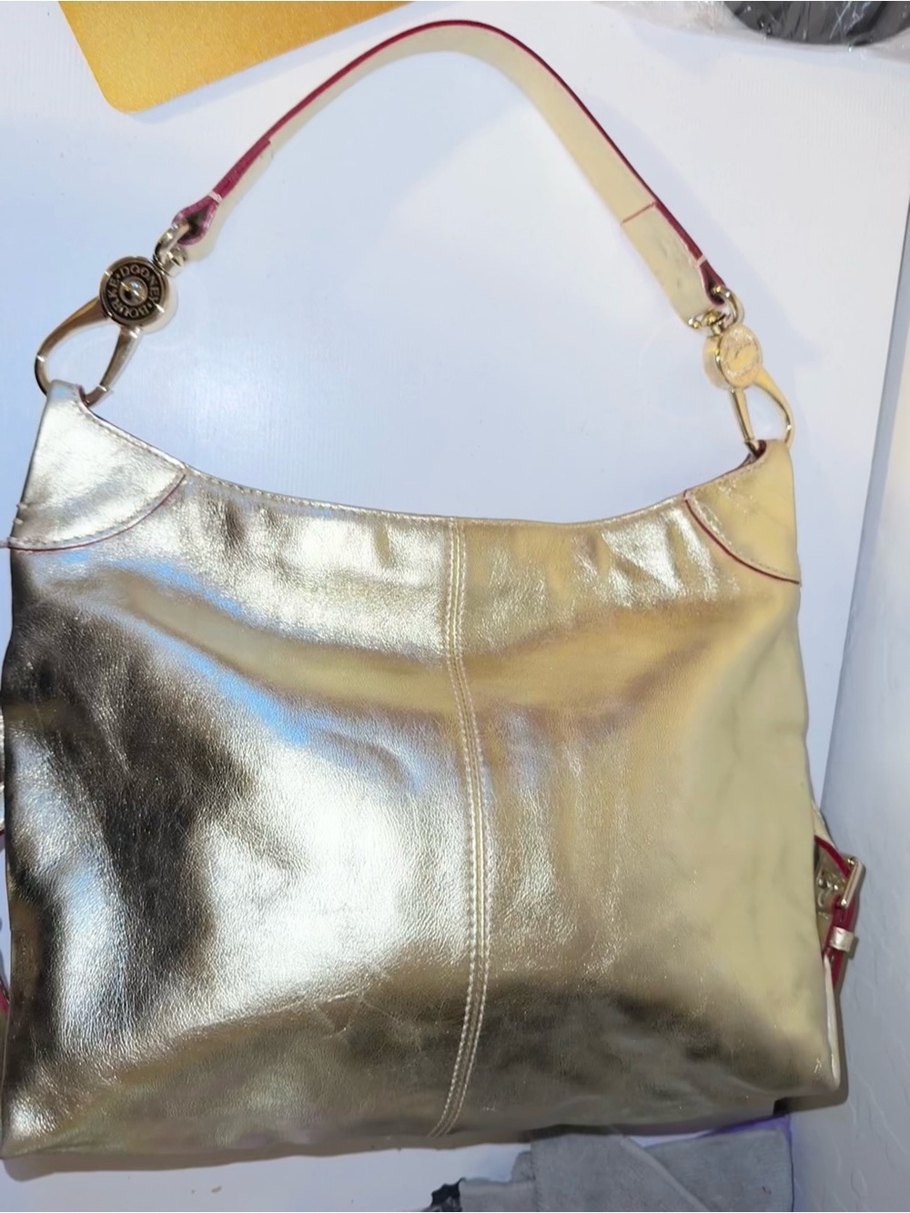 Dooney & Bourke Metallic Gold Leather Shoulder Bag with Pink interior like new